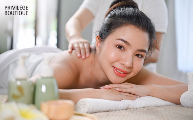Woman receiving a holistic back massage for hormonal balance.