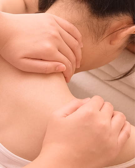 Woman applying lipstick and skincare mask.